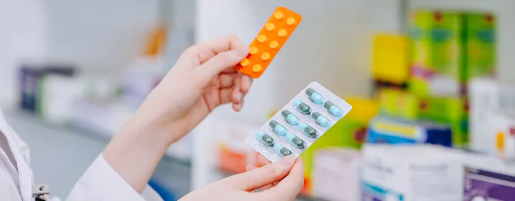 Pharmacist comparing medicines